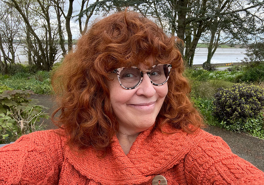 Janice MacDonald wearing a rust-coloured Aran sweater.
