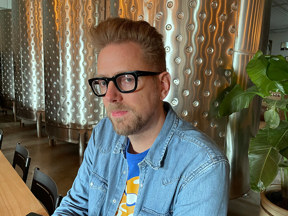 Andrew Unger wearing a light blue shirt.